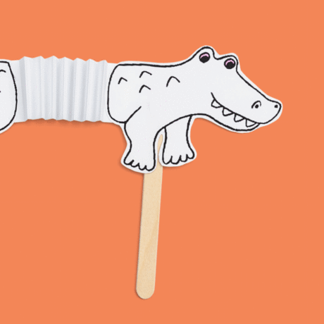 Alligator accordion paper craft against orange background