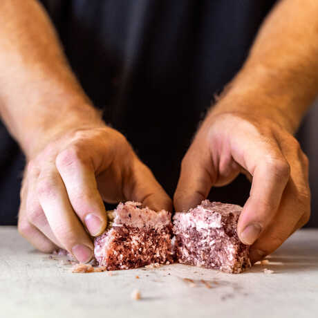 Biologist Walker Calhoun prepares a frozen krill steak. 