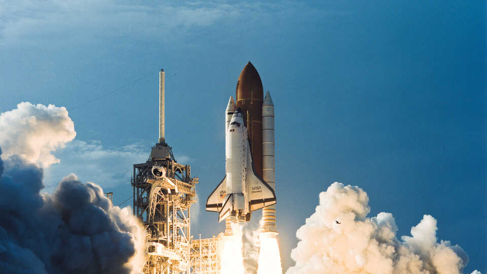 Space Shuttle blasting off