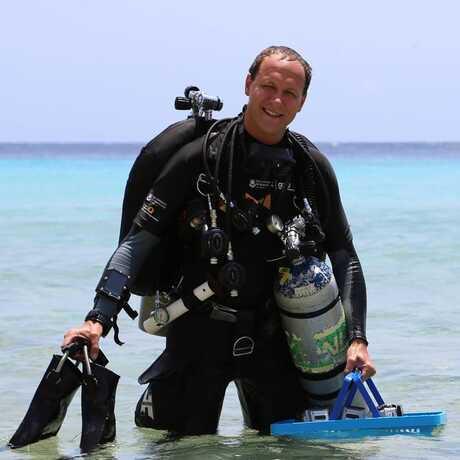 Pim Bongaerts and wife Kyra Hay in shallow water after a scientific dive