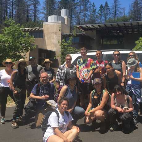 Students and instructors in front of an Academy van at Pepperwood Preserve.
