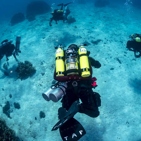A group of scuba divers underwater in the Marshall Islands