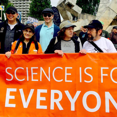 March for Science banner says "Science is for Everyone" held by Academy staff