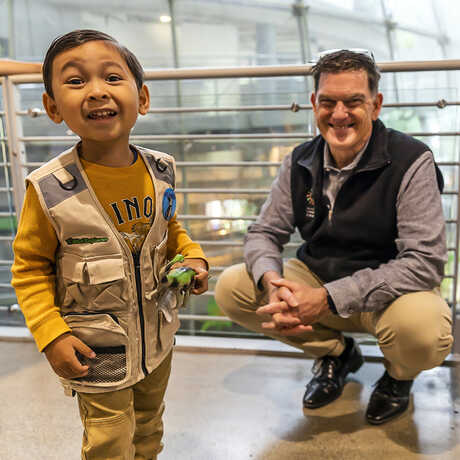 Excited young member meeting Dr. Scott Sampson at Member Preview event